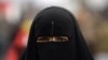 Egypt -- An anti-government protestor wears a full veil, or niqab, on Tahrir Square in Cairo, 07Feb2011