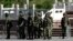 China -- Chinese paramilitary policemen stand guard on a city square in Urumqi in China's Xinjiang region on May 24, 2014. China has seen a series of incidents in recent months targeting civilians, sometimes far from Xinjiang itself, which authorities ha
